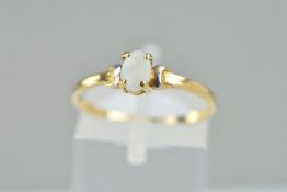 A MODERN SINGLE STONE OPAL RING, ring size P, stamped '9ct', approximate gross weight 0.9 grams