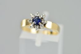 A MODERN SAPPHIRE AND DIAMOND ROUND CLUSTER RING, ring size L, stamped '10k', approximate gross