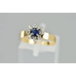A MODERN SAPPHIRE AND DIAMOND ROUND CLUSTER RING, ring size L, stamped '10k', approximate gross