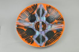 A POOLE POTTERY DELPHIS STUDIO CHARGER, abstract design on orange ground, shape 54, diameter 41cm