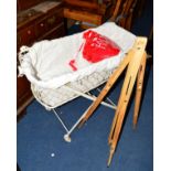 A PAINTED VICTORIAN WROUGHT IRON FOLDING COT on ceramic casters and an artists easel