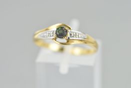 A GEM RING, the central green gem with two diamond accents to the shoulders, stamped 375, ring