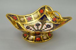 A ROYAL CROWN DERBY OLD IMARI FOOTED BASKET, '1128' solid banded pattern, approximate length 28.