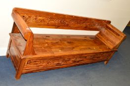 A HARDWOOD WINDOW SEAT, with hinged compartment, approximate width 196cm