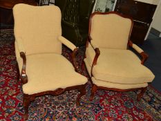 A REPRODUCTION LIBRARY CHAIR of wide proportions, together with another similar library chair (2)