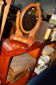 A WALNUT OVAL SWING MIRROR and a tin trunk (2)