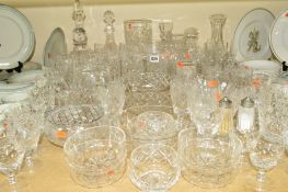 A QUANTITY OF CUT GLASS, to include drinking glasses, decanter, vases and finger bowls etc