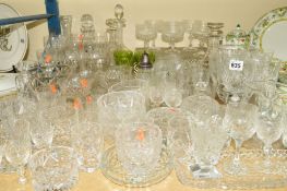 A QUANTITY OF CUT GLASS ETC, to include drinking glasses, vases, decanters and dressing table