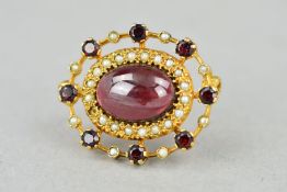 A 9CT GOLD GARNET AND SPLIT PEARL BROOCH, the central oval garnet cabochon within a split pearl
