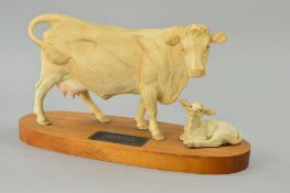 A BESWICK CONNOISSEUR CHAROLAIS COW AND CALF, No 3075A/1827B, on wooden plinth