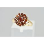 A MID TO LATE 20TH CENTURY GARNET CLUSTER RING, ring size M, hallmarked 9ct gold, Birmingham 1977,