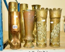 SEVEN TRENCH ART SHELL CASES, including a pair with heavily textured bodies embossed with flowers,