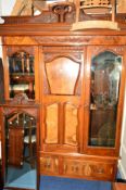 AN EDWARDIAN WALNUT TWO PIECE BEDROOM SUITE, comprising of a mirrored two door wardrobe with central