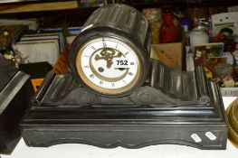 A LATE 19TH CENTURY BLACK SLATE MANTEL CLOCK, fluted drum shaped case above scrolled rectangular