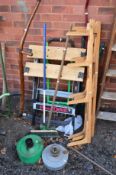 A FOLDING WORK BENCH, lawn aerator, three pine shelf brackets and garden tools