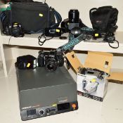 A MINOLTA 7000 FILM SLR, fitted with a 35-70mm f4, a Panasonic Lumix FZ38 Digital camera, an Olympus