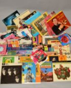 A COLLECTION OF OVER 200 SINGLES AND OVER 30 L.P'S, artists include Elvis Presley, The Beatles, Matt