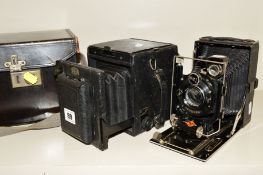 A DALLMEYER PLATE CAMERA, (no lens) in leather case and an Agfa Isolar Folding camera