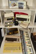 A SELECTION OF COMMODORE VINTAGE PERSONAL COMPUTERS AND ACCESSORIES, this includes two 64s, a VC 20,