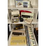 A SELECTION OF COMMODORE VINTAGE PERSONAL COMPUTERS AND ACCESSORIES, this includes two 64s, a VC 20,