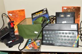 A SINCLAIR ZX SPECTRUM, with manual, Joystick, RAM Turbo and five games