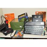 A SINCLAIR ZX SPECTRUM, with manual, Joystick, RAM Turbo and five games