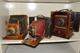 AN EASTMAN KODAK 6 X 4'' PLATE CAMERA, with a Voigtlander 12cm lens on a stained wood frame, an