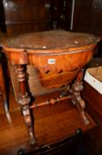 A VICTORIAN BURR WALNUT AND INLAID SEWING TABLE on a turned stretcher base (sd to top)