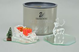 TWO BOXED SWAROVSKI CRYSTAL ORNAMENTS, Santa's Sleigh, with presents and a reindeer (2)