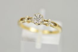 A 9CT GOLD DIAMOND RING, designed as an illusion set single cut diamond to the open shoulders,
