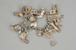 A SILVER CHARM BRACELET, the double curb link bracelet suspending fifteen charms many hinged, to
