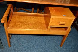 A LIGHT OAK TELEPHONE TABLE with a single drawer