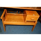 A LIGHT OAK TELEPHONE TABLE with a single drawer