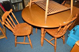 A MODERN BEECH AND OAK CIRCULAR DINING TABLE and three chairs (4)