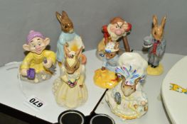 SEVEN ROYAL DOULTON AND BESWICK FIGURES, to include two Doulton Snow White figures 'Irresistibly