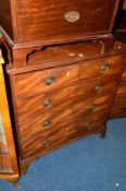 A GEORGIAN MAHOGANY CHEST of two short and three long drawers on outsplayed bracket feet,