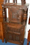 A NARROW EARLY 20TH CENTURY CARVED OAK COURT CUPBOARD, with two cupboard doors, approximate size