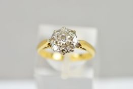 A DIAMOND CLUSTER RING, the central brilliant cut diamond within a single cut diamond surround,