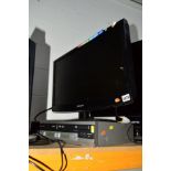 A SAMSUNG 23' LCD TV, a Sharp VHS / DVD player (two remotes)