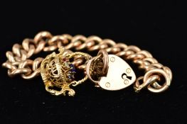 AN EARLY 20TH CENTURY HOLLOW CURB LINK CHARM BRACELET, together with a later added fancy basket