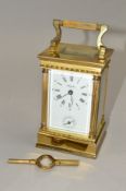 A MODERN ANGELUS BRASS CARRIAGE CLOCK, white enamel dial with subsidiary alarm dial, bell strike