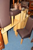A MODERN LIGHT OAK DINING SUITE comprising of a square topped table, four chairs, a sideboard with