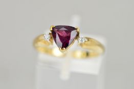 A 9CT GOLD GARNET AND DIAMOND RING, the triangular garnet flanked by brilliant cut diamonds,