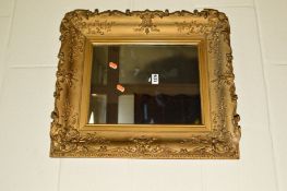 AN 18TH CENTURY GILT FRAMED WALL MIRROR with foliate mouldings, approximate width 50cm x height 58cm