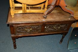 AN 18TH CENTURY CARVED OAK SIDE TABLE with two drawers, on turned front legs, approximate width