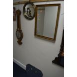 A 20TH CENTURY CIRCULAR BRASS CONVEX WALL MIRROR, a mahogany wall mirror and another mirror (3)