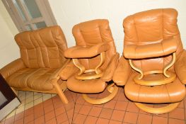 A PAIR OF EKCORNES TAN LEATHER SWIVEL ARMCHAIRS with foostools, together with a similar two seater