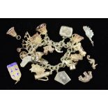 A MID TO LATE 20TH CENTURY SILVER CHARM BRACELET, together with eighteen assorted charms to