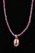 A MODERN GARNET BEAD AND PURPLISH BROWN CULTURED FRESHWATER PEARL NECKLACE, round faceted garnet