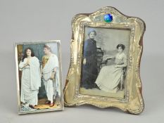 TWO EARLY 20TH CENTURY SILVER FRONTED FRAMES, the first of plain rectangular design, hallmarked